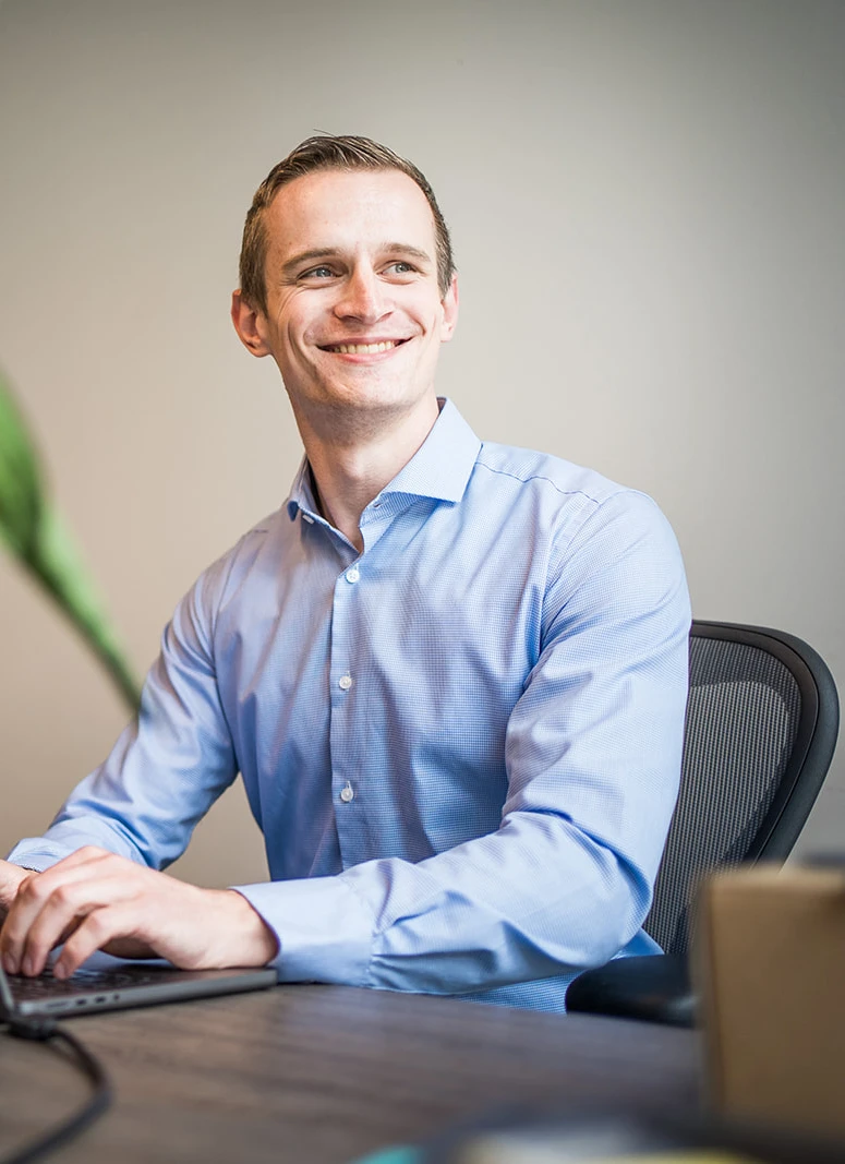 Arjan Schouten sitting behind his desk